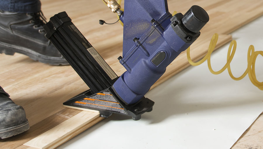 Newly installed hardwood planks in a bright space