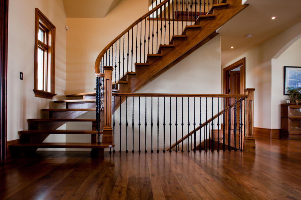 Modern staircase with wooden treads and black railing